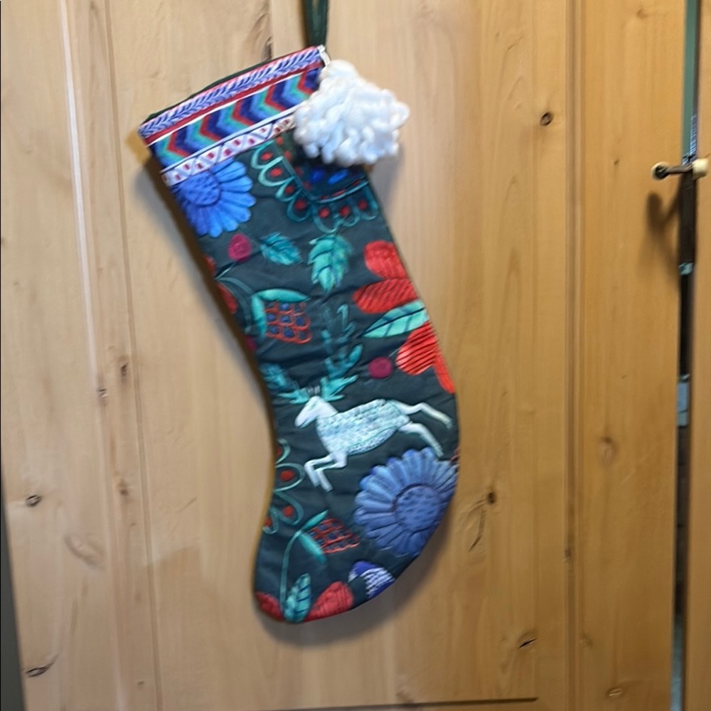Festive Green Holiday Stocking with Colorful Patterns